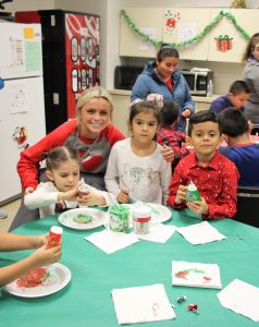Ms. Ziegler and students enjoying the cookie decorating