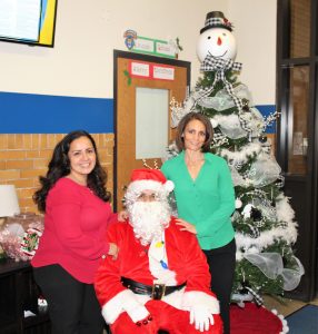 Ms. Gomez-Munoz and Ms. Williams with Santa